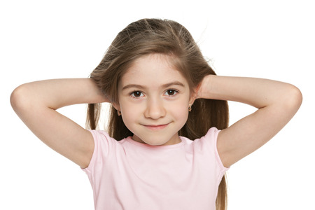 A portrait of an adorable little girl  on the white backgroundの写真素材
