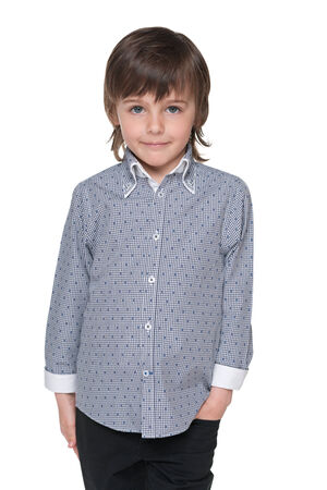 A portrait of a cute fashion young boy against the white backgroundの写真素材