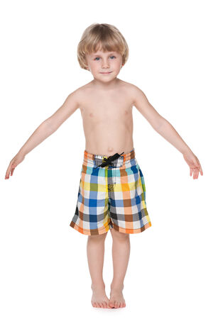 A portrait of a cute little boy getting ready for swimmingの写真素材