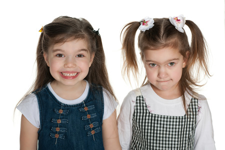 A portrait of pretty little girls against the white backgroundの写真素材
