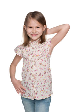 A portrait of a cheerful little girl on the white backgroundの写真素材