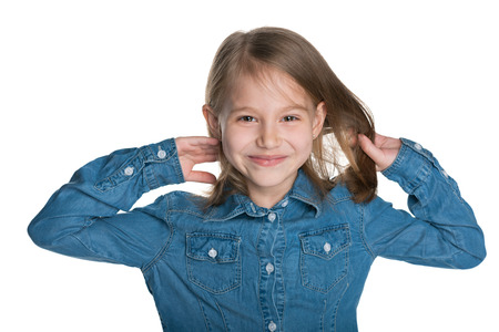 A portrait of a pretty little girl with flowing hair on the white backgroundの写真素材