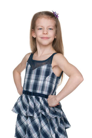 A portrait of a confident fashion little girl on the white backgroundの写真素材
