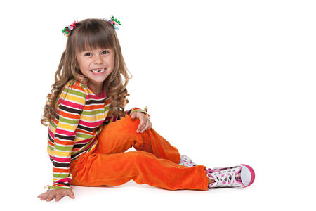 A portrait of a laughing pretty little girl on the white backgroundの写真素材