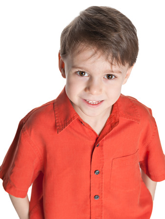 A closeup portrait of a cute little boy on the white backgroundの写真素材