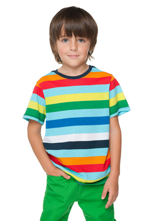 A portrait of a fashion smiling boy in a striped shirt on the white backgroundの写真素材