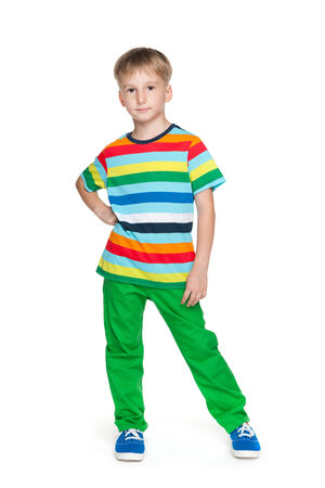 A portrait of a happy handsome little boy in a stripeed shirt against the white backgroundの写真素材