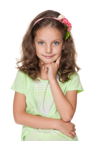 A portrait of a cute little girl on the white backgroundの写真素材