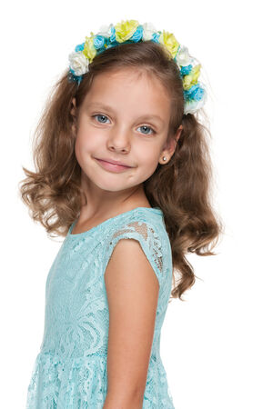 A happy lovely little girl against the white backgroundの写真素材
