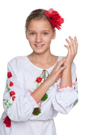 A cheerful preteen Ukrainian girl against the white backgroundの写真素材