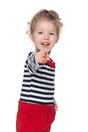 A lovely little girl shows her finger forwardの写真素材