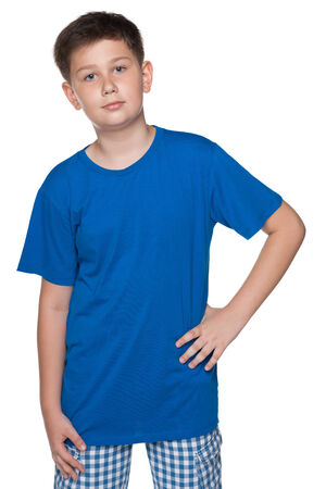 A cute boy is standing on the white backgroundの写真素材