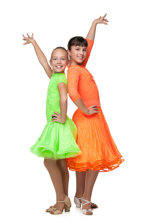 Two dancing girls against the white backgroundの写真素材