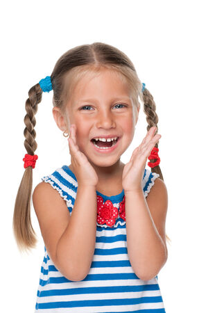 A joyful little girl on the white の写真素材