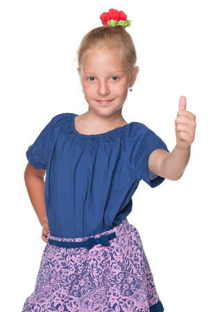 Happy girl holds her thumb up on the white の写真素材