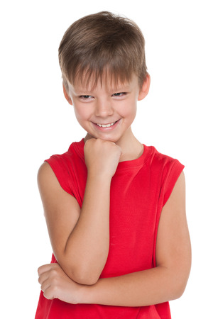 A portrait of a happy boy in a red shirt on the white の写真素材