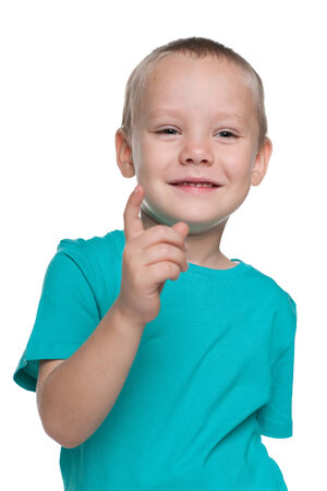 A portrait of a thinking little boy on the white の写真素材