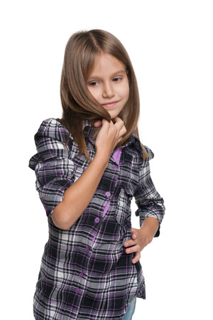 A portrait of a thinking young girl on the white の写真素材
