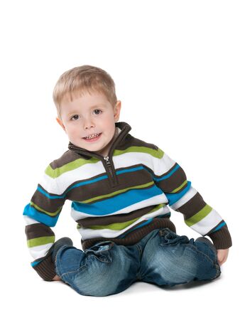 A portrait of a cute little boy in a sweater on the white の写真素材