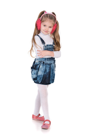 A portrait of a lovely fashion little girl on the white の写真素材