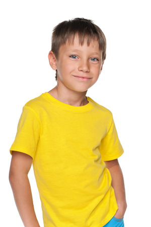 A young boy in a yellow shirt on the white の写真素材