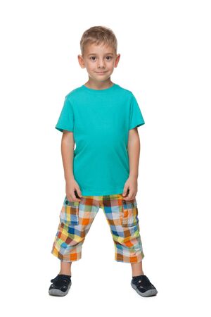 A portrait of a little boy in a blue shirt on the white の写真素材