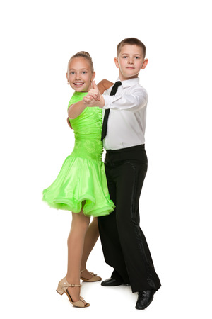 Two children are dancing against the white backgroundの写真素材