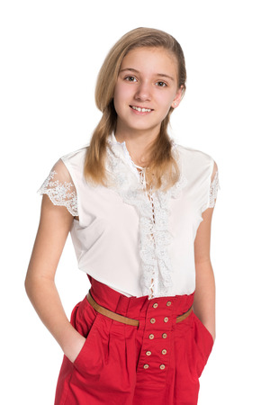 A portrait of a smiling teen girl against the white backgroundの写真素材