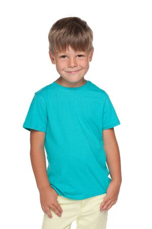 A portrait of a cute little boy in a blue shirt on the white backgroundの写真素材