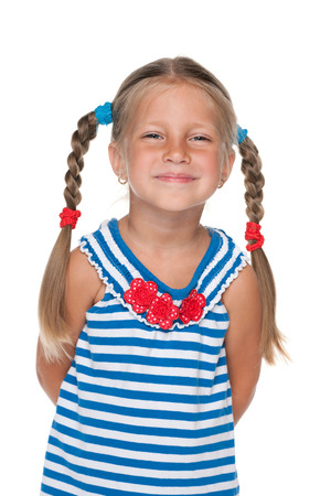 A portrait of a smiling little girl on the white backgroundの写真素材