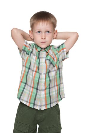 A cute little blond boy imagines on the white backgroundの写真素材