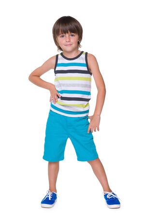 A portrait of a cute little boy in a striped vest against the white backgroundの写真素材