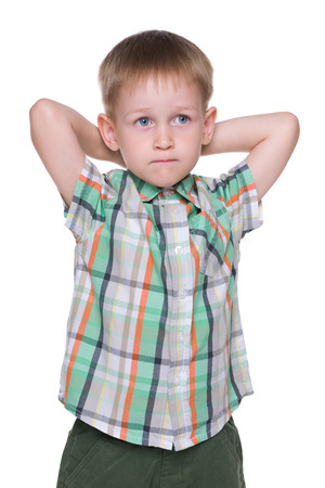 A cute little boy imagines on the white backgroundの写真素材