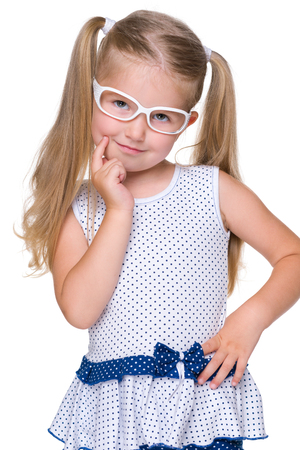 A portrait of a blonde little girl on the white backgroundの写真素材