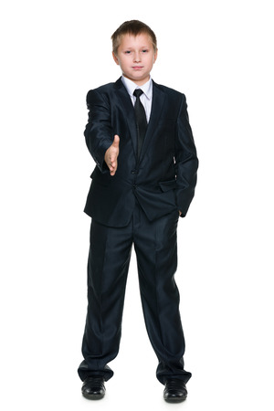 A young boy is going to shake a handの写真素材