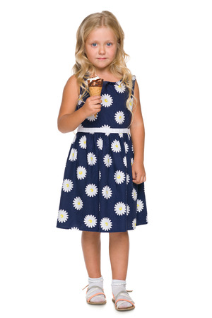 A blonde little girl with ice cream on the white backgroundの写真素材