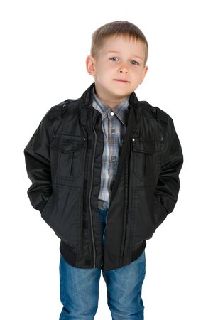 A portrait of a confident little boy in a jacket against the white backgroundの写真素材