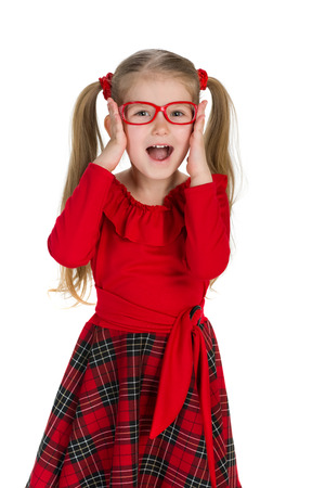 A portrait of a joyful little girl against the white backgroundの写真素材