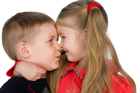 Closeup portrait of two children on the white backgroundの写真素材