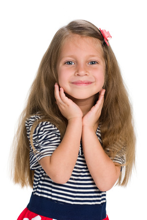 A portrait of a cheerful pretty little girl on the white backgroundの写真素材