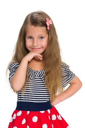 An adorable little girl against the white backgroundの写真素材