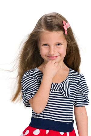 A portrait of a pretty little girl with flowing hair on the white backgroundの写真素材