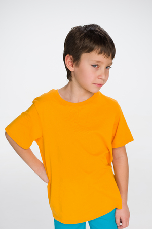 A thoughtful little boy on the gray backgroundの写真素材