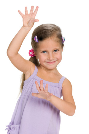 A portrait of a funny little girl on the white backgroundの写真素材