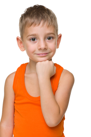A portrait of a thoughtful preschool boy on the white backgroundの写真素材