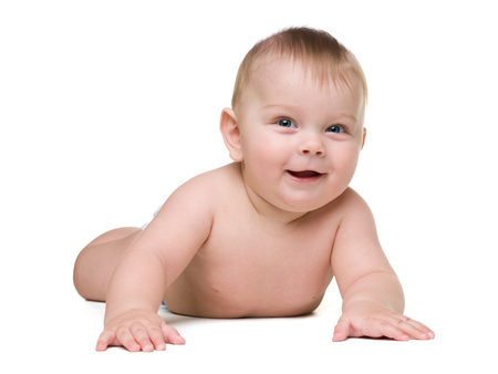 A cute baby boy is lying on the white backgroundの写真素材