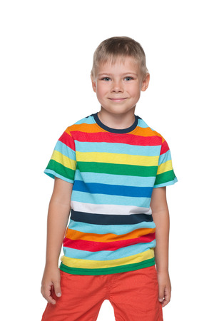 A portrait of a happy little boy in the stripeed shirt against the white backgroundの写真素材