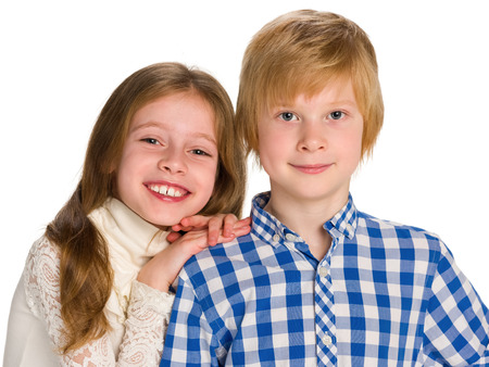 A portrait of two smiling children against the white backgroundの写真素材