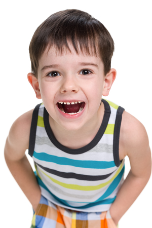 A portrait of a laughing little boy on the white backgroundの写真素材