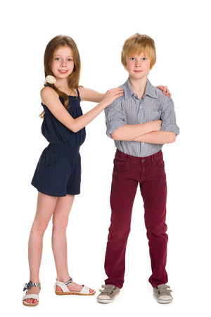 A portrait of two happy fashion kids on the white backgroundの写真素材